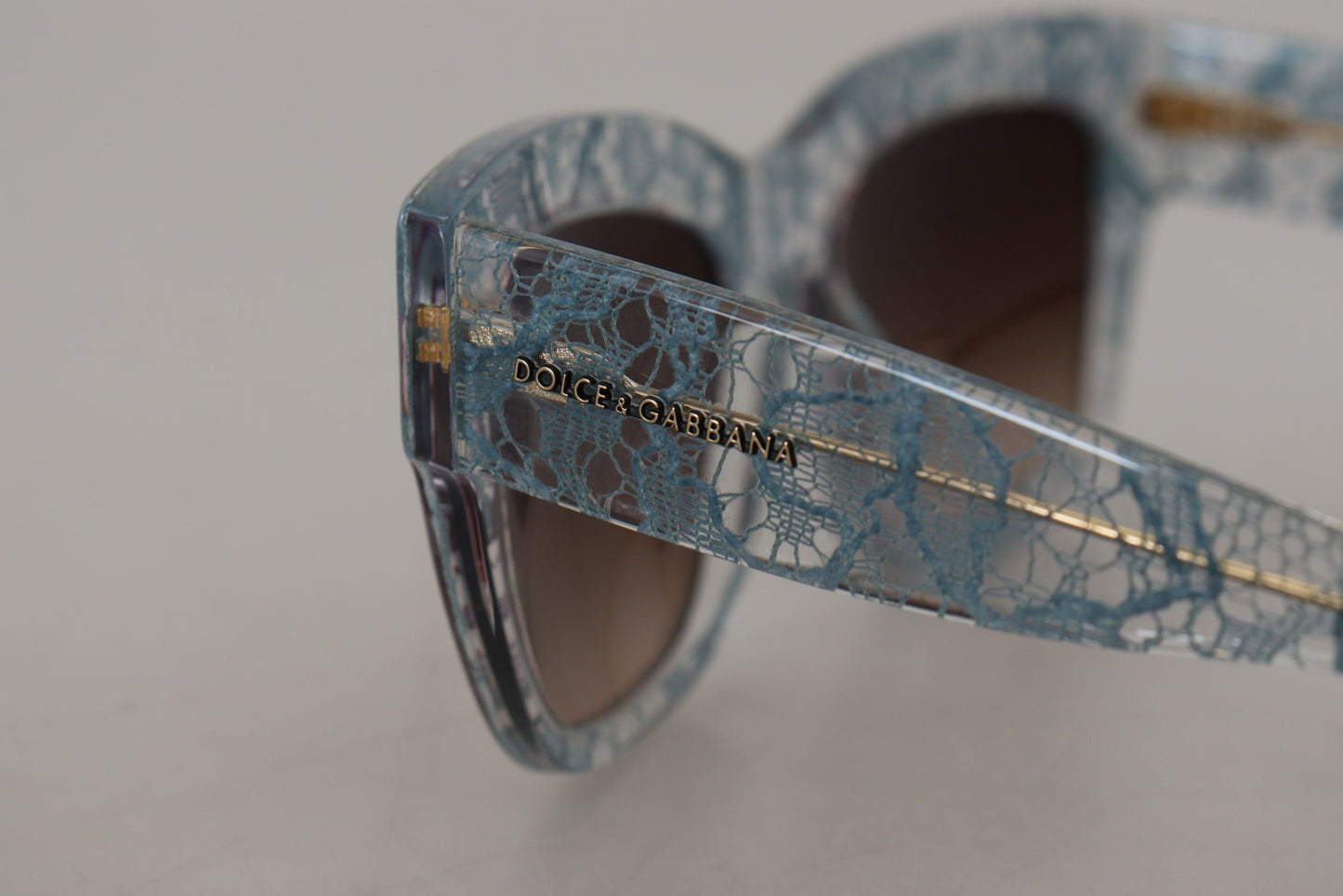 Dolce &amp; Gabbana Elegant blue sunglasses with lace detail