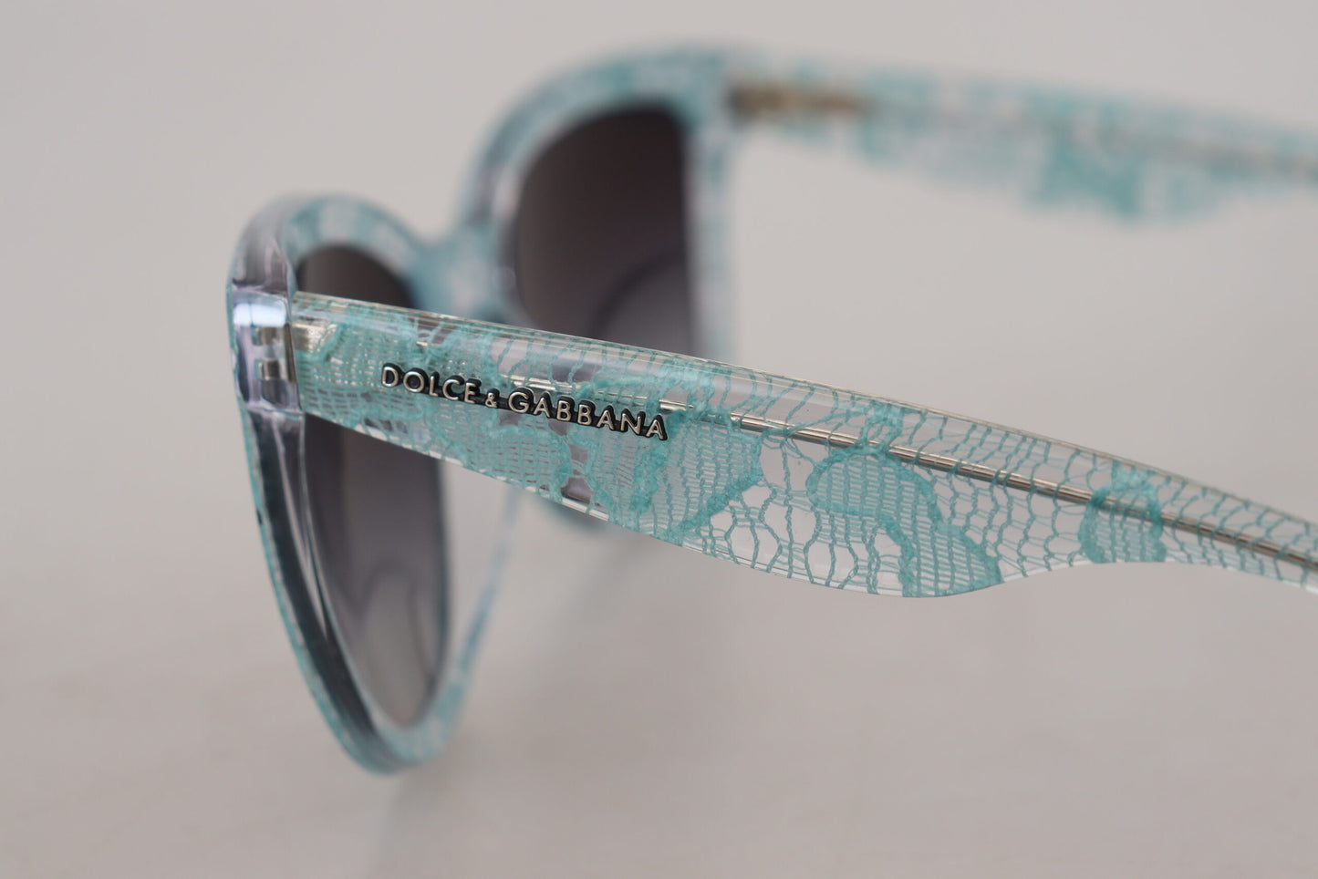 Dolce &amp; Gabbana Elegant blue sunglasses with lace detail